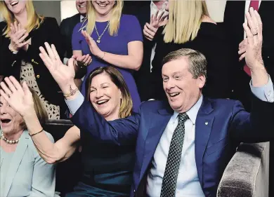  ?? FRANK GUNN THE CANADIAN PRESS ?? Toronto Mayor John Tory and wife Barbara Hackett, along with other family and friends, celebrate after his re-election on Monday. Tory defeated former city planner Jennifer Keesmaat.