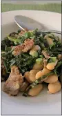  ?? PHOTO BY CATHY THOMAS ?? Kale with cannelini beans and sausage is a hearty main course that is easy to make.