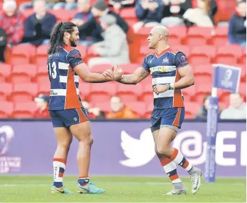  ??  ?? File photo shows Bristol Rugby’s Tom Varndell (right) celebrates scoring their second try with team mate Thretton Palamo during the European Rugby Challenge Cup Pool Four between Bristol Rugby and Pau at the Ashton Gate. — Reuters photo