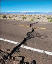  ??  ?? U.S. Highway 95 bears the marks of the damage done by a 6.5-magnitude quake that struck western Nevada early Friday. (AP/Nevada Highway Patrol)