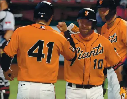  ?? ANDA CHU — STAFF PHOTOGRAPH­ER ?? The Giants’ Evan Longoria (10) celebrates a two-run home run with Wilmer Flores (41) during the team’s current six-game winning streak.