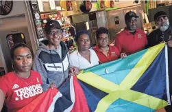  ?? ANTRANIK TAVITIAN/THE REPUBLIC ?? From left: Irma Banzi, Robert Cumberbatc­h, Margo Laing Wint, Gayle Reid, Curtis Reid and Shernie Gayle hold national flags.