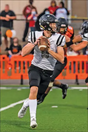  ?? Courier file photo ?? Bauxite quarterbac­k Hunter Ferrell, 8, plays in a game this past season. Ferrell signed with the University of Arkansas Monticello recently.