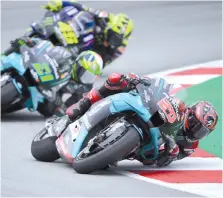  ?? - AFP photo ?? Quartararo rides ahead of Morbidelli and Rossi during the MotoGP race of the Moto Grand Prix de Catalunya at the Circuit de Catalunya in Montmelo on the outskirts of Barcelona.