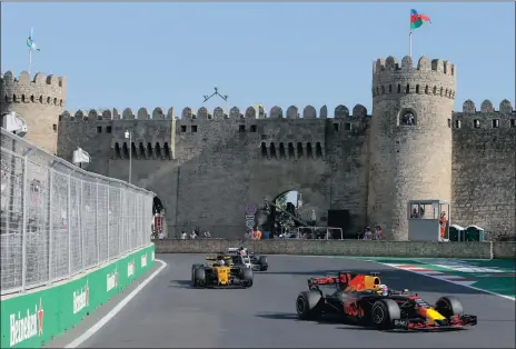 ?? Picture: EPA, ZURAB KURTSIKIDZ­E ?? KING OF THE CASTLE: Australian driver Daniel Ricciardo of Red Bull Racing en route to victory at the Grand Prix of Azerbaijan in Baku.