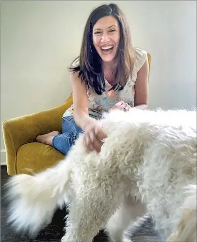  ?? Jay L. Clendenin Los Angeles Times ?? JULIE GENTRY, shown with her dog Martha via FaceTime, is part of the upcoming “Real World Homecoming” reunion.