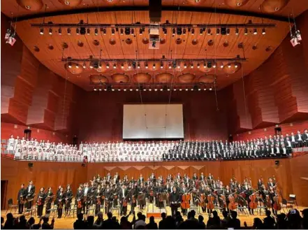  ?? Photo courtesy of Youngeum Arts Management ?? KICKING UP A FUSS: Koo Ja-bom and members of the Cham Philharmon­ic Orchestra and four choirs greet the audience after performing Beethoven's Symphony No. 9 in Korean for the first time on May 7 at the Seoul Arts Centre.