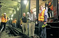  ??  ?? Desperate for cash: Cuomo, here touring subway tracks last fall, wants to give the MTA the power to seize some city property-tax payments.