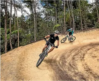  ?? PHOTOS: BRADEN FASTIER/FAIRFAX NZ ?? Ross Maley, Manager, Kaiteriter­i Mountain Bike Park pictured with rider Morgan Walker.