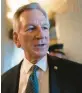  ?? J. SCOTT APPLEWHITE/AP ?? Sen. Tommy Tuberville, R-Ala., a member of the Armed Services Committee, talks to reporters as he arrives at the chamber for votes on Sept. 6. On Tuesday, Tuberville ended his blockade on hundreds of military promotions.