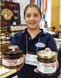  ??  ?? MARY Grace Sebanes and her Chilloy’s Gourmet sauces and condiments