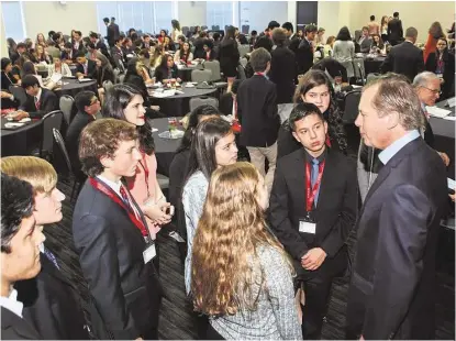  ?? Genesis Photograph­ers ?? Former Lt. Gov. David Dewhurst chats with teens at the West Houston Teen Leadership Summit on Feb. 20. The event helped teens learn business fundamenta­ls from some of the top leaders in Texas.