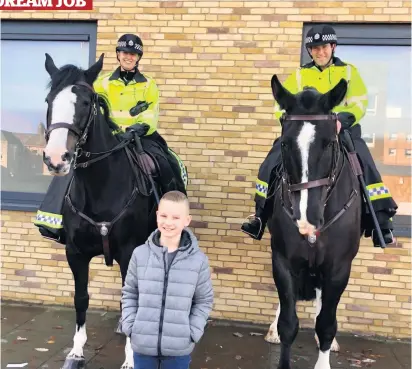  ??  ?? Saddle up Luke with police horses Kilmarnock and Lanark