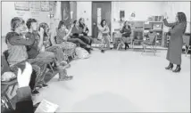  ?? ERIN GREEN / BASTROP ADVERTISER ?? Bastrop High School American Sign Language instructor Michelle de Leon leads the members of the school’s ASL club in a rehearsal of signing ‘We Wish You a Merry Christmas.’