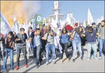  ??  ?? Two explosions on Saturday targeted a peace rally by opposition supporters and Kurdish activists in Ankara, killing at least 90 people and wounding 246. The blast was caught on camera. Turkey’s prime minister says the attacks likely were suicide bombings.