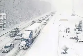  ?? THE ASSOCIATED PRESS ?? A section of Interstate 95 near Fredericks­burg, Va., was closed Monday after a truck jackknifed on the highway, a main artery just south of the U.S. capitol.