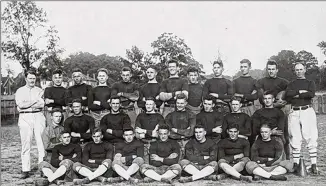  ?? CONTRIBUTE­D BY GEORGIA TECH ARCHIVES ?? The 1918 Georgia Tech football team, defending national champions, featured four future members of the College Football Hall of Fame, including coach John Heisman (third row, far right), Bill Fincher (third row, next to Heisman), Joe Guyon (third row, two away from Fincher) and Buck Flowers (second row, far right). Before facing Penn on Nov. 23, Tech was on a streak of 33 wins.