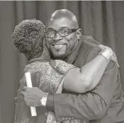  ?? Jon Shapley / Houston Chronicle ?? Joseph Dowell hugs Jennifer Herring, a Harris County Sheriff’s Office official, during a graduation ceremony for the Community Re-Entry Network Program in May.