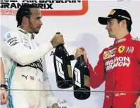  ??  ?? Hamilton congratula­tes Leclerc on the podium