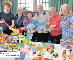  ??  ?? Smiling Volunteers at the toy stall 090317burn­side_02