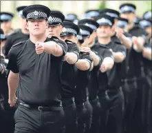  ??  ?? Recruits march at Police Scotland HQ at Tulliallan