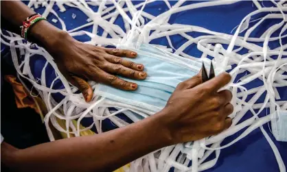  ?? Photograph: Luis Tato/AFP via Getty Images ?? A worker producing face masks at a factory in Kitui, Kenya.