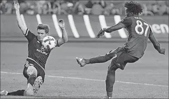  ?? [CHRIS YOUNG/THE CANADIAN PRESS] ?? Crew midfielder Wil Trapp, left, says he’s a proponent of video replay to make sure calls are correct, even if it interrupts the flow of play.