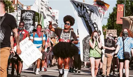  ?? — AFP ?? Loud and proud: Hundreds of people taking to the streets for the Black Pride RVA March to protest the killing of Floyd and call for racial justice in Richmond, Virginia.