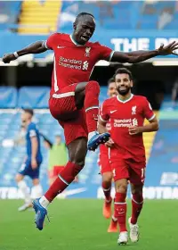  ??  ?? Easy does it: Mane celebrates his second goal yesterday