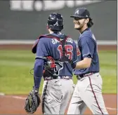  ?? Mary Schwalm / Associated Press ?? Ian Anderson, right, said he is more familiar with catchers like Travis d'arnaud going into his second season with the Braves.