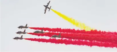  ??  ?? The Al Forsan aerobatic team perform during an air display for Xi Jinping during the reception in Abu Dhabi on Friday.