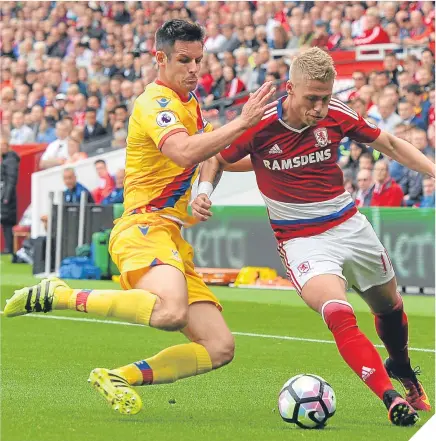  ??  ?? Viktor Fischer of Middlesbro­ugh (right) tries to get past Eagles defender Scott Dann.