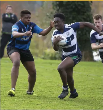  ??  ?? Jason Lawson of Sligo Grammar in possession against St. Gerald’s of Castlebar. The Grammar were comprehens­ive winners, winning 48-0.