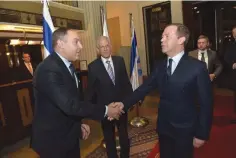  ?? (Courtesy) ?? SHELDON RITZ, operations manager at the King David Hotel, welcomes Russian Prime Minister Dmitry Medvedev while the hotel’s manager Haim Shkedy looks on.