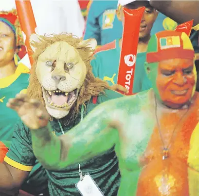  ?? Picture: Reuters ?? VIBRANT. Supporters show their colours ahead of the Afcon fixture between Burkina Faso and Cameroon at the Stade de l’Amite at the weekend.