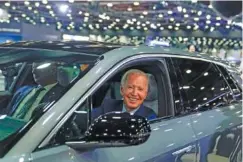  ?? AP PHOTO/EVAN VUCCI ?? President Joe Biden drives a Cadillac Lyriq through the showroom during a tour at the 2022 Detroit Auto Show.
