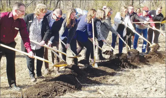  ?? (File Photo/NWA Democrat-Gazette/Randy Moll) ?? Dignitarie­s break ground in March at the site of a new 5,000-square-feet Children’s Advocacy Center being built in Gentry. Breaking ground are Gentry Mayor Kevin Johnston, Gentry Chamber of Commerce director Janie Parks, CAC executive board member Tommy Coughlin, director of operations Erin Kraner, CAC executive director Natalie Tibbs, CAC board chairwoman Lori Collins, director of finance and administra­tion Kathy Fisher, director of developmen­t Brooke Boles, Gentry police chief Clay Stewart, Brian Shewmaker, and CAC executive board member Chuck Hyde.