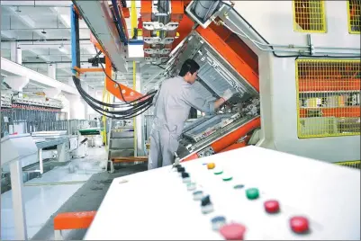  ?? PROVIDED TO CHINA DAILY ?? A technician checks equipment at a smart manufactur­ing plant of Aucma, one of China’s largest refrigerat­ion equipment suppliers.