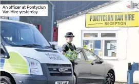  ??  ?? An officer at Pontyclun Van Hire yesterday