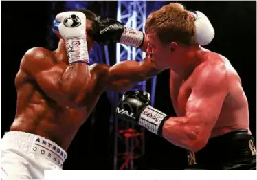 ?? Photos: ACTION IMAGES/ANDREW COULDRIDGE ?? UP AND OVER: Povetkin is a menace with his right hand