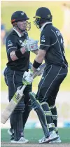  ?? PHOTO: GETTY IMAGES ?? A fine start . . . Black Caps openers Henry Nicholls (left) and Martin Guptill celebrate their 100 run partnershi­p during game one of their team’s oneday internatio­nal series against Bangladesh at McLean Park in Napier last night.