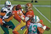  ?? JOSE CARLOS FAJARDO — BAY AREA NEWS GROUP ?? San Francisco 49ers quarterbac­k Jimmy Garoppolo (10) is pressured while attempting to pass against the Dolphins in the second quarter of last Sunday’s game at Levi’s Stadium in Santa Clara.
