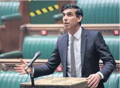  ?? UK PARLIAMENT VIA AFP ?? Chancellor of the Exchequer Rishi Sunak speaks on the emergency Covid-19 support measures in a socially distanced, hybrid session of the House of Commons in London on Monday.