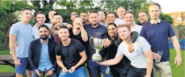  ??  ?? The Ingles squad celebrate their Senior League title triumph.