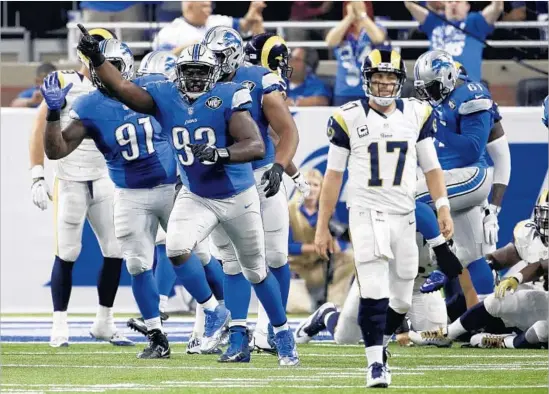  ?? Duane Burleson Associated Press ?? DEFENSIVE TACKLE Tyrunn Walker (93) led a surge that stopped Rams on fourth down at the one before halftime, then led celebratio­n as Case Keenum walked off.