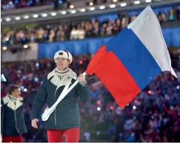  ?? AFP ?? In this file photo Russia’s bobsledder Alexander Zubkov leads his national delegation during the opening ceremony of the Sochi Winter Olympics. —