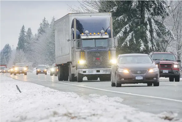  ?? MARK VAN MANEN/PNG ?? More snow and continuing cold temperatur­es were forecast for the Fraser Valley, creating more headaches for drivers such as these making their way east on the Trans Canada Highway, near Mount Lehman Road outside of Abbotsford on Sunday.