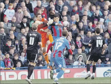  ??  ?? OUT OF REACH: Paul Jones fails to get to a free-kick that led to the Palace goal.