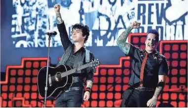  ?? THEO WARGO/GETTY IMAGES ?? Billie Joe Armstrong and Tre Cool of Green Day perform in 2017 in New York City. Green Day announced it will tour with Weezer and Fall Out Boy for the “Hella Mega” stadium tour.
