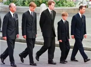  ??  ?? Emotional: Harry, second from right, with Royals at Diana’s 1997 funeral